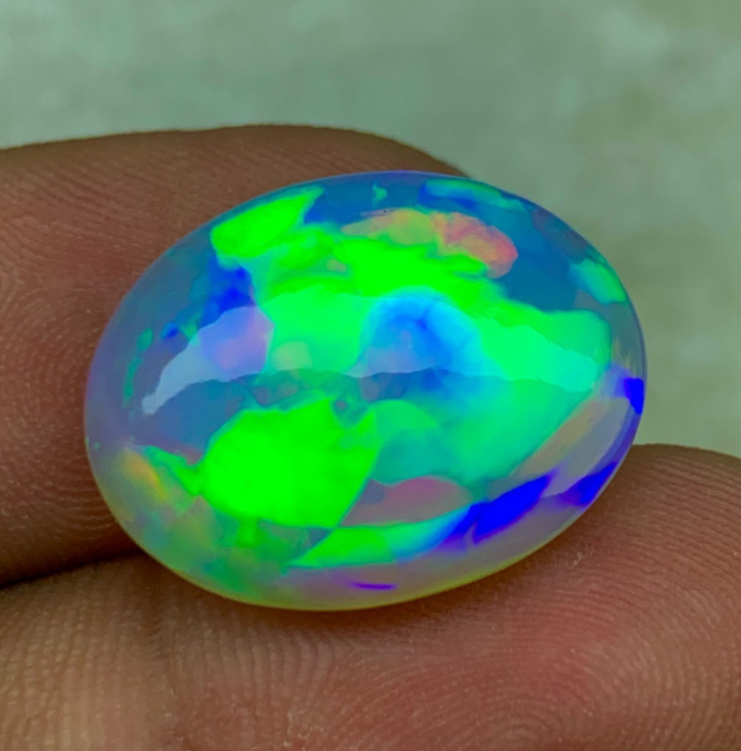 Natural Ethiopian Opal 8.30 Carat Oval Cabochon Rainbow Fire Welo Gemstone