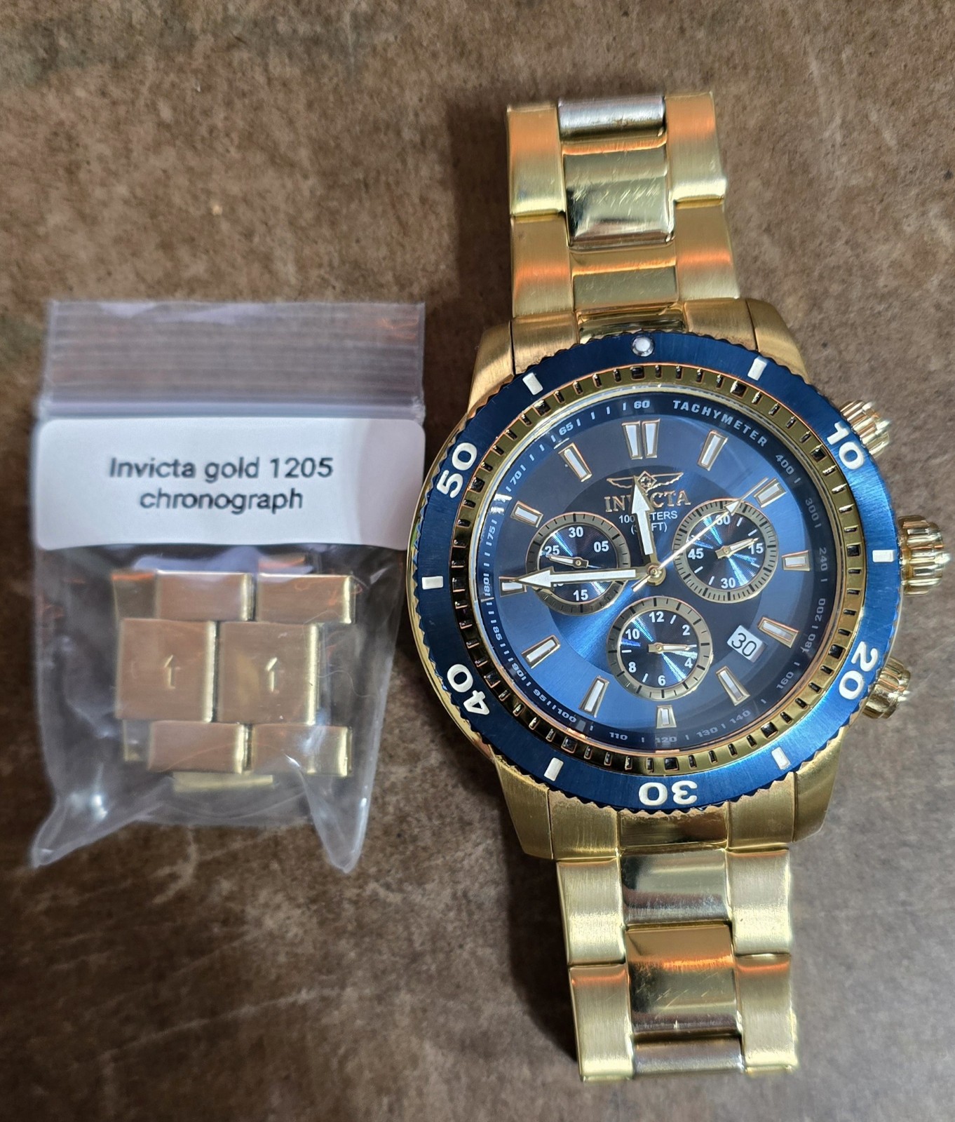 Invicta Men’s Watch Model 1205 chronograph gold with blue dial and bezel