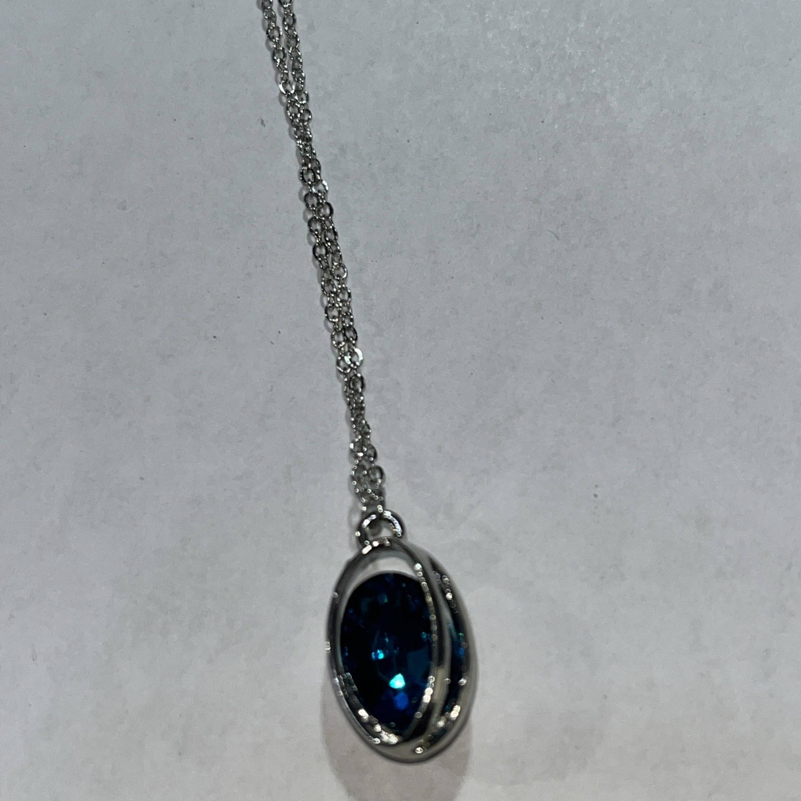 Blue rhinestone necklace in silvertone cage 14″ adjustable