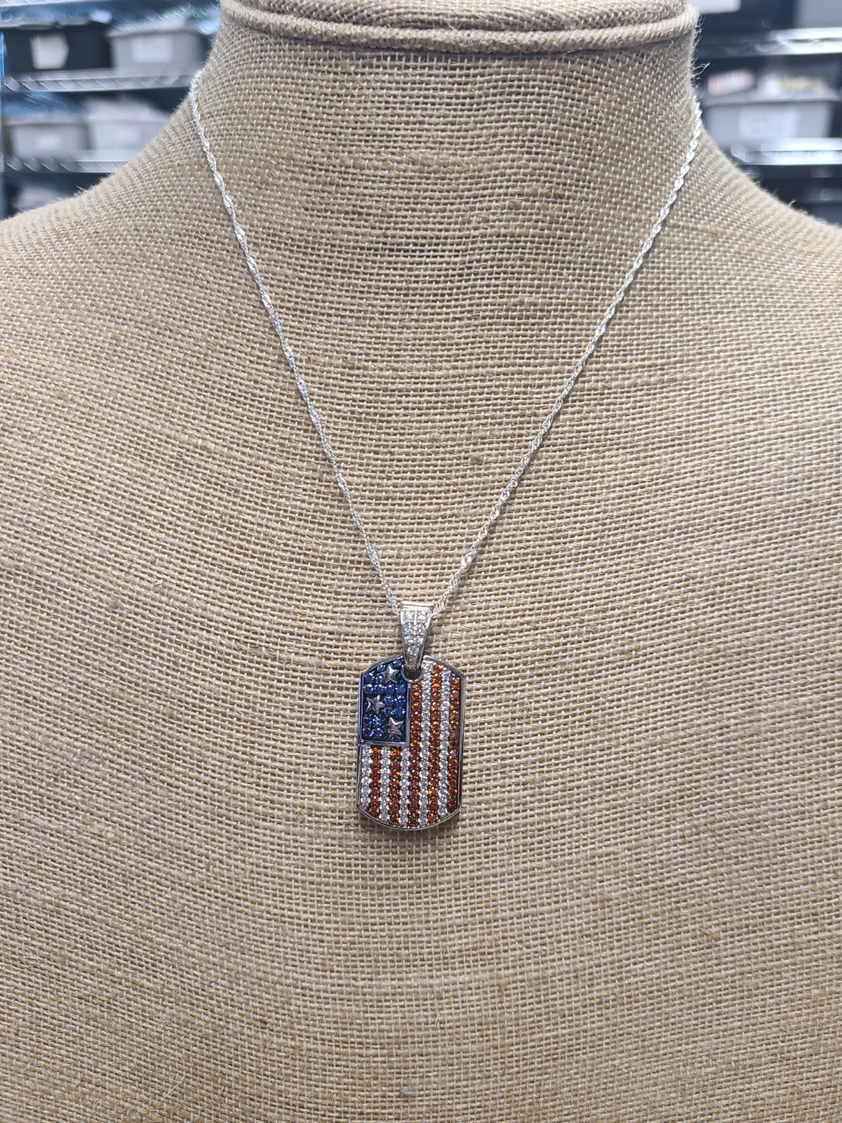 Garnet, White, And Blue Cubic Zirconia Rhodium Plated Ottone Flag Enhancer Penda
