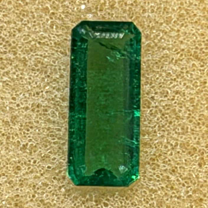 Natural Zambian Green Emerald Emerald Cut GGI MI Excellent Cut 9.4×4.2×3.8mm