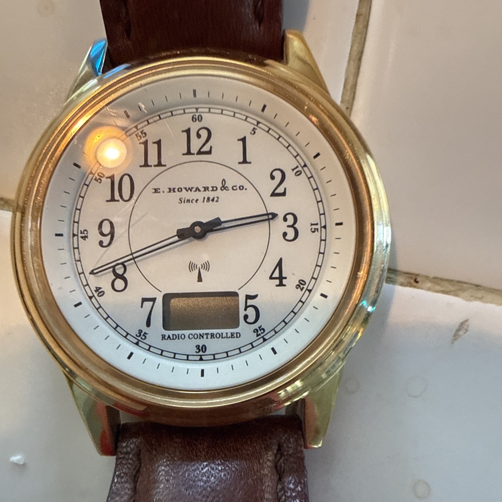 E Howard & Co Radio Controlled Atomic Watch Junghans Movement Gold Brown Leather