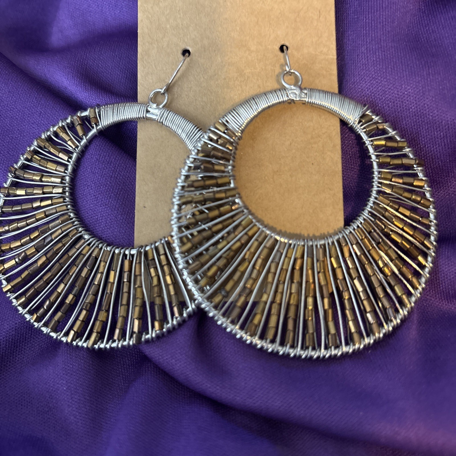 large silver wire wrapped hoop earrings w/ pewter beads.
