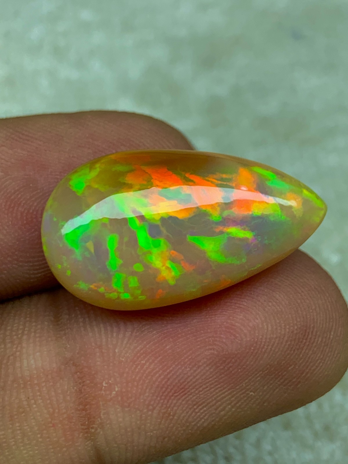 Natural Ethiopian Opal Honeycomb Pattern 14.90 Carat Multi-Fire Pear Cabochon