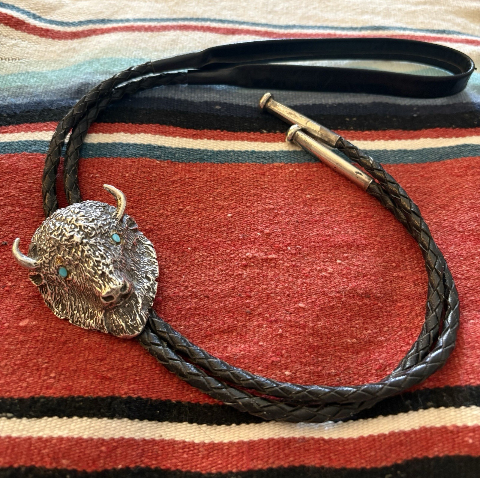 Buffalo Head Bolo Tie-Solid Cast Silver with Turquoise eyes