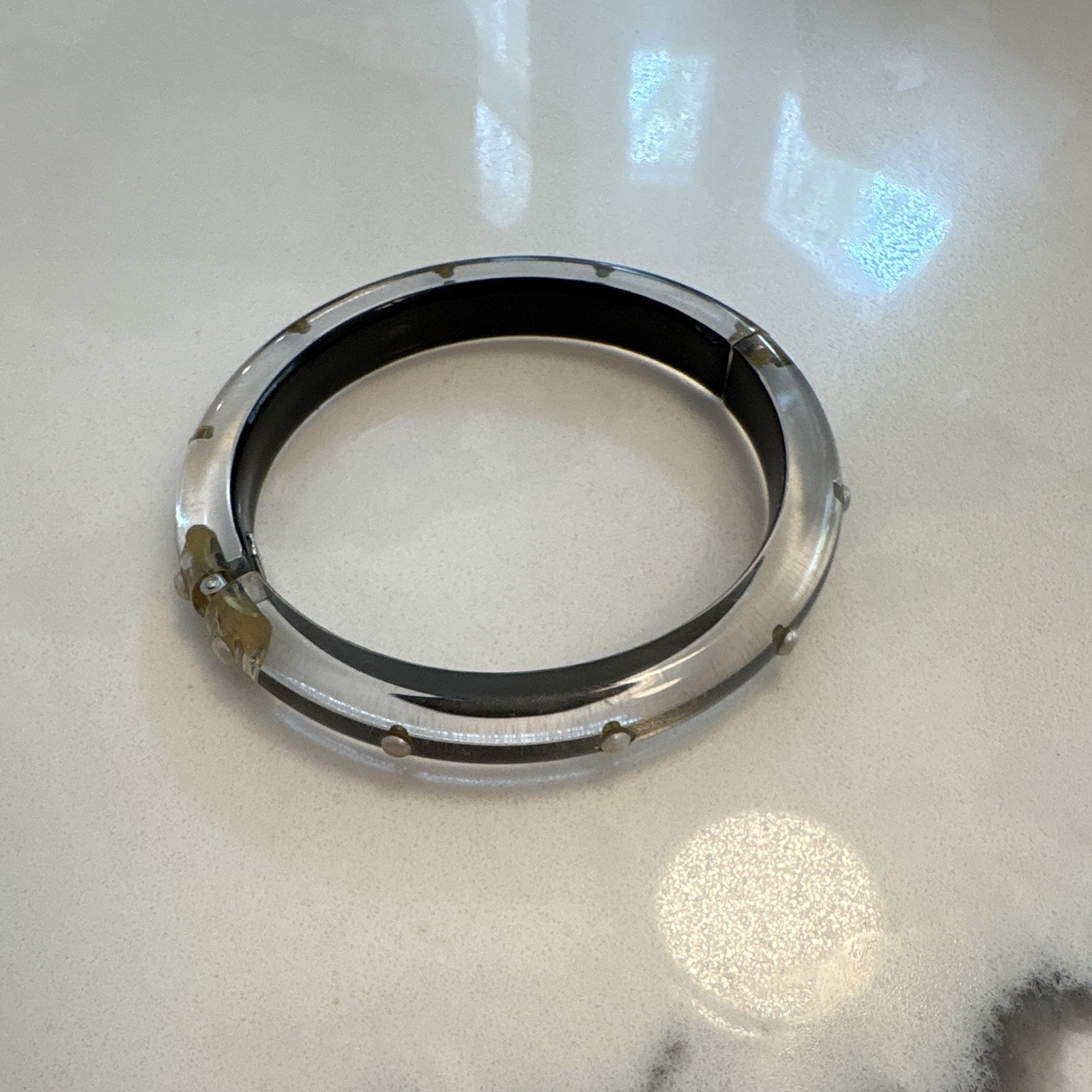 Alexis Bittar bangle features polished, hand-carved lucite accented with crystal