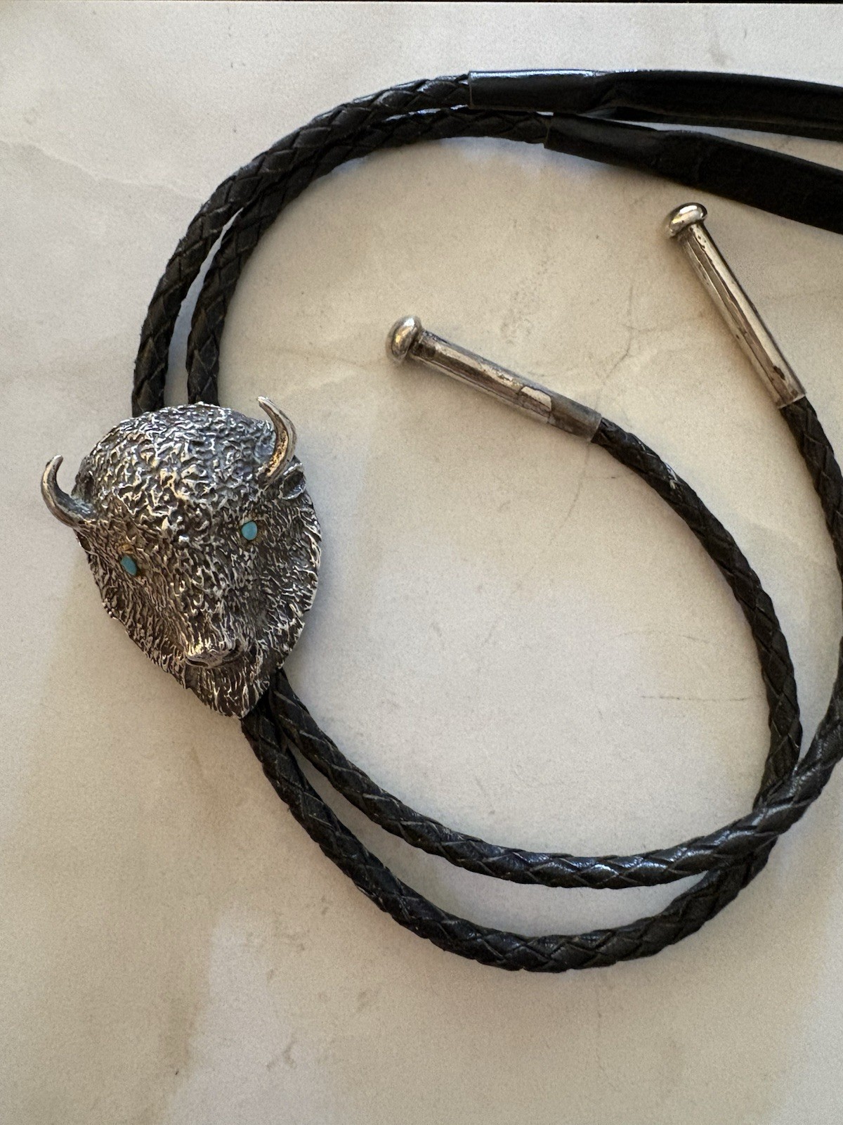 Buffalo Head Bolo Tie-Solid Cast Silver with Turquoise eyes