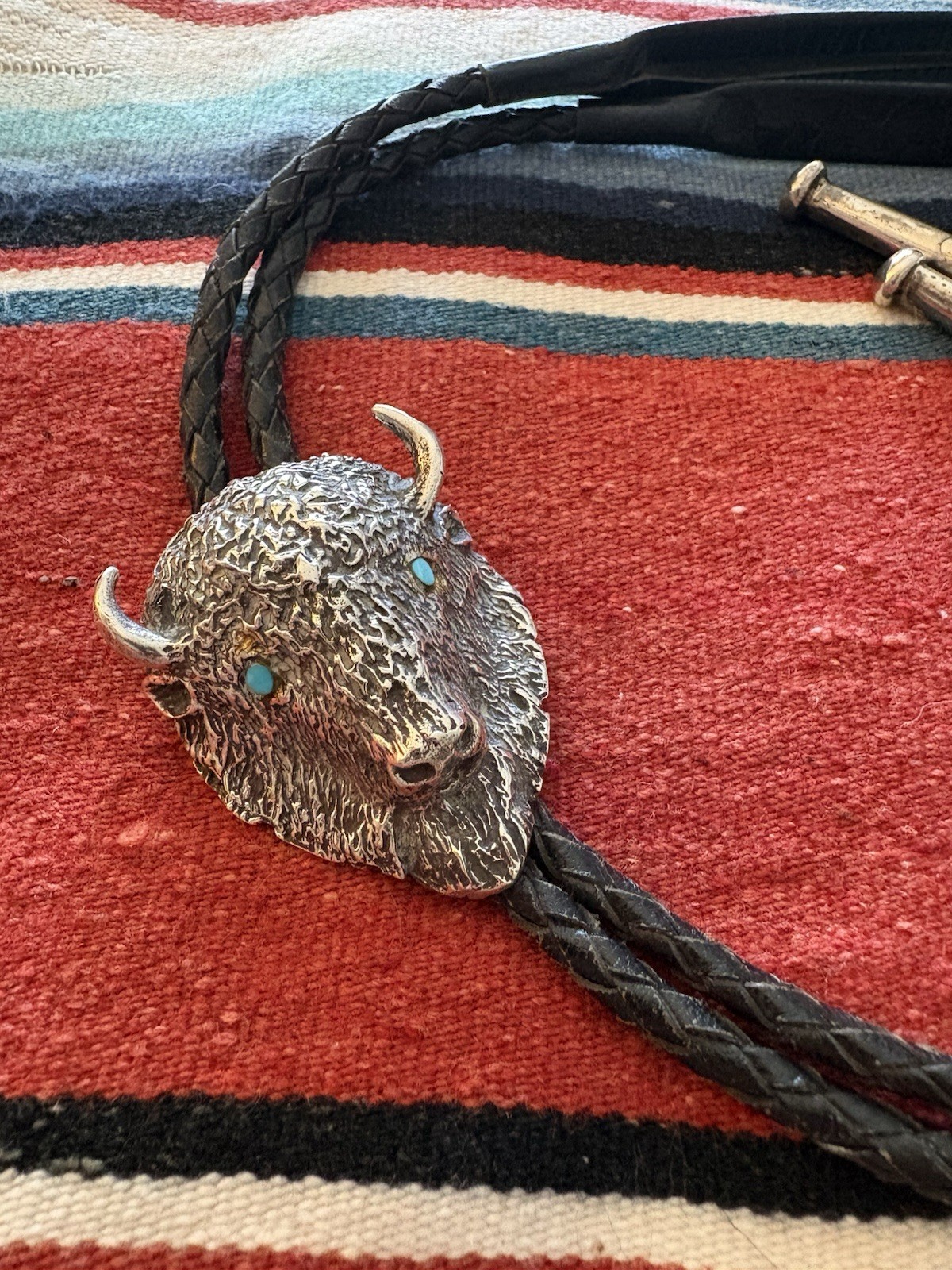 Buffalo Head Bolo Tie-Solid Cast Silver with Turquoise eyes