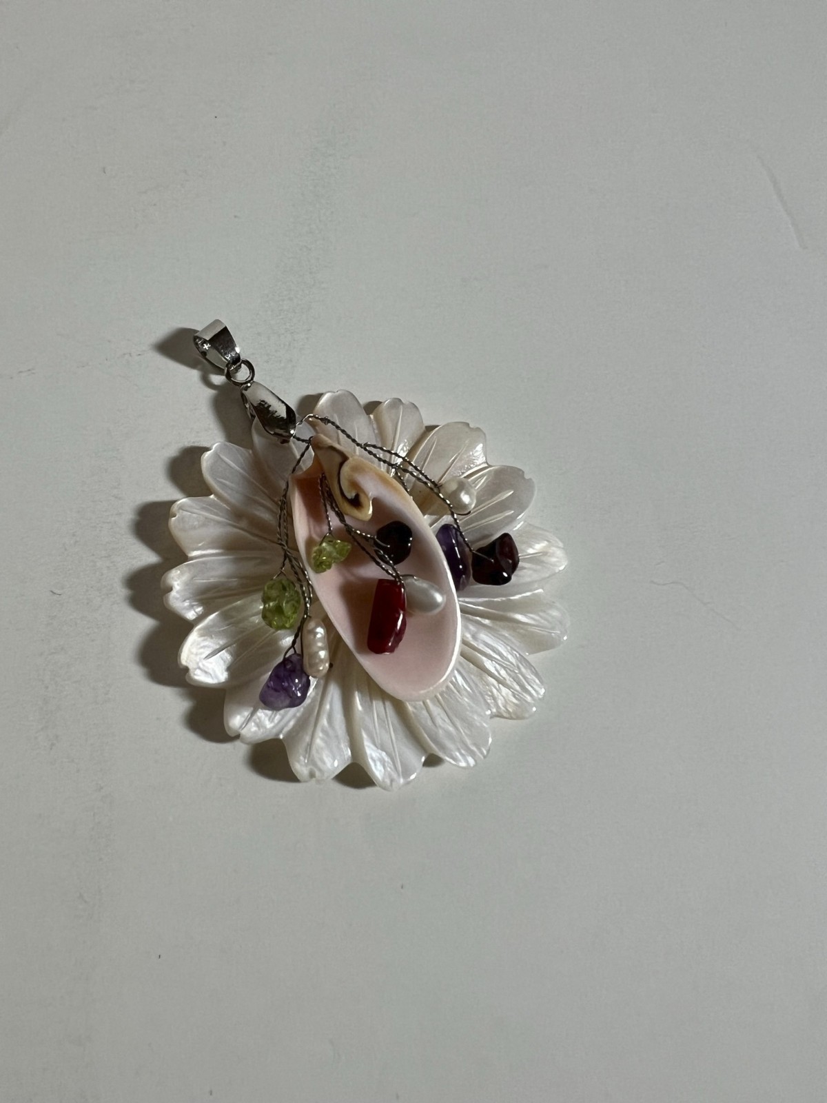 Handcarved Mother of Pearl Shell Floral Pendant. No maker mark found.