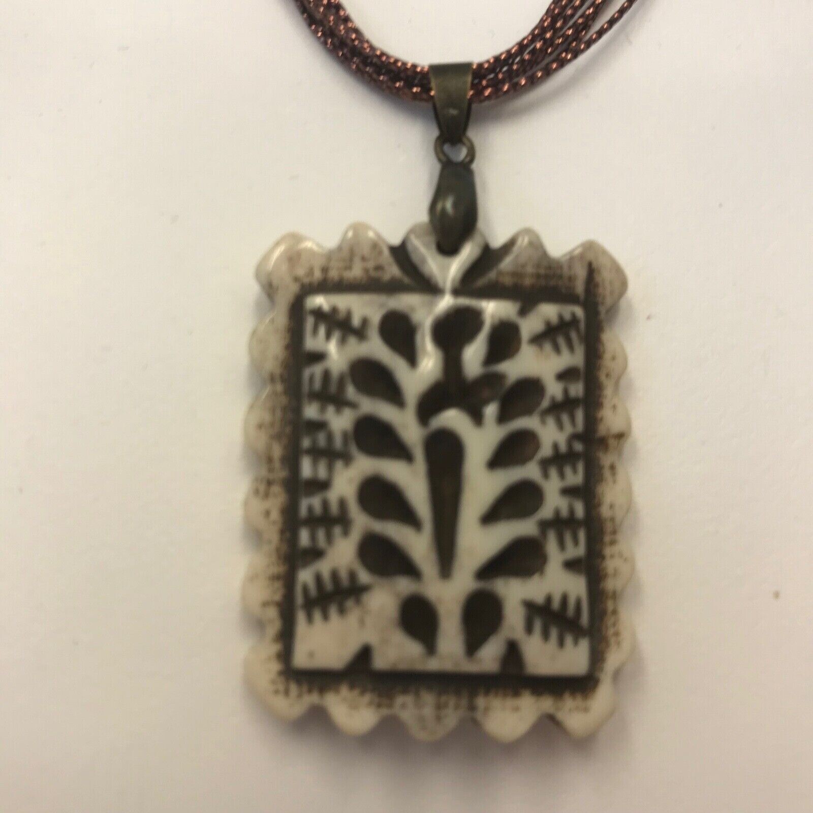 Rectangular Fluted Bone Pendant on a Bronze Tone Polyester Multi Cord Necklace