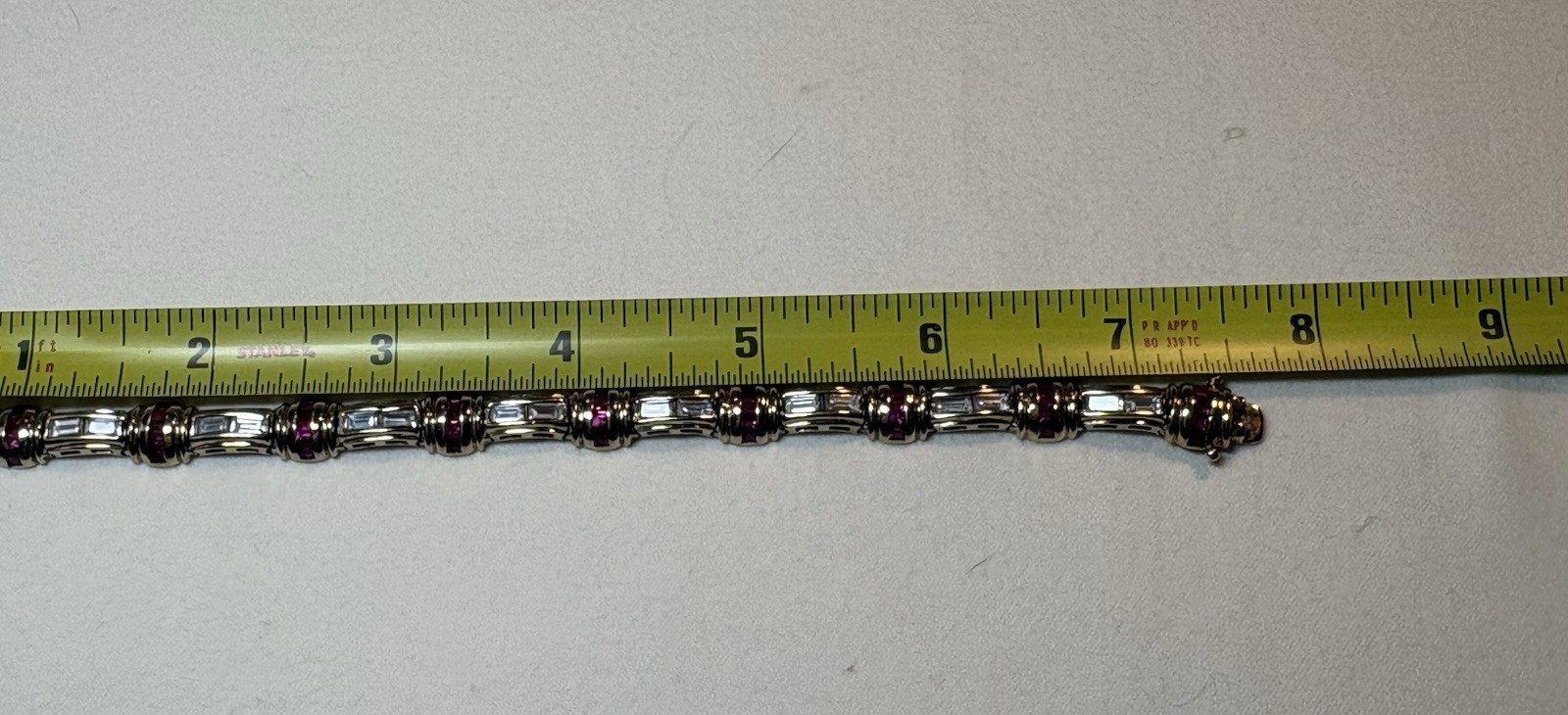 A sterling silver bracelet featuring baguette and round cubic zirconia stones.