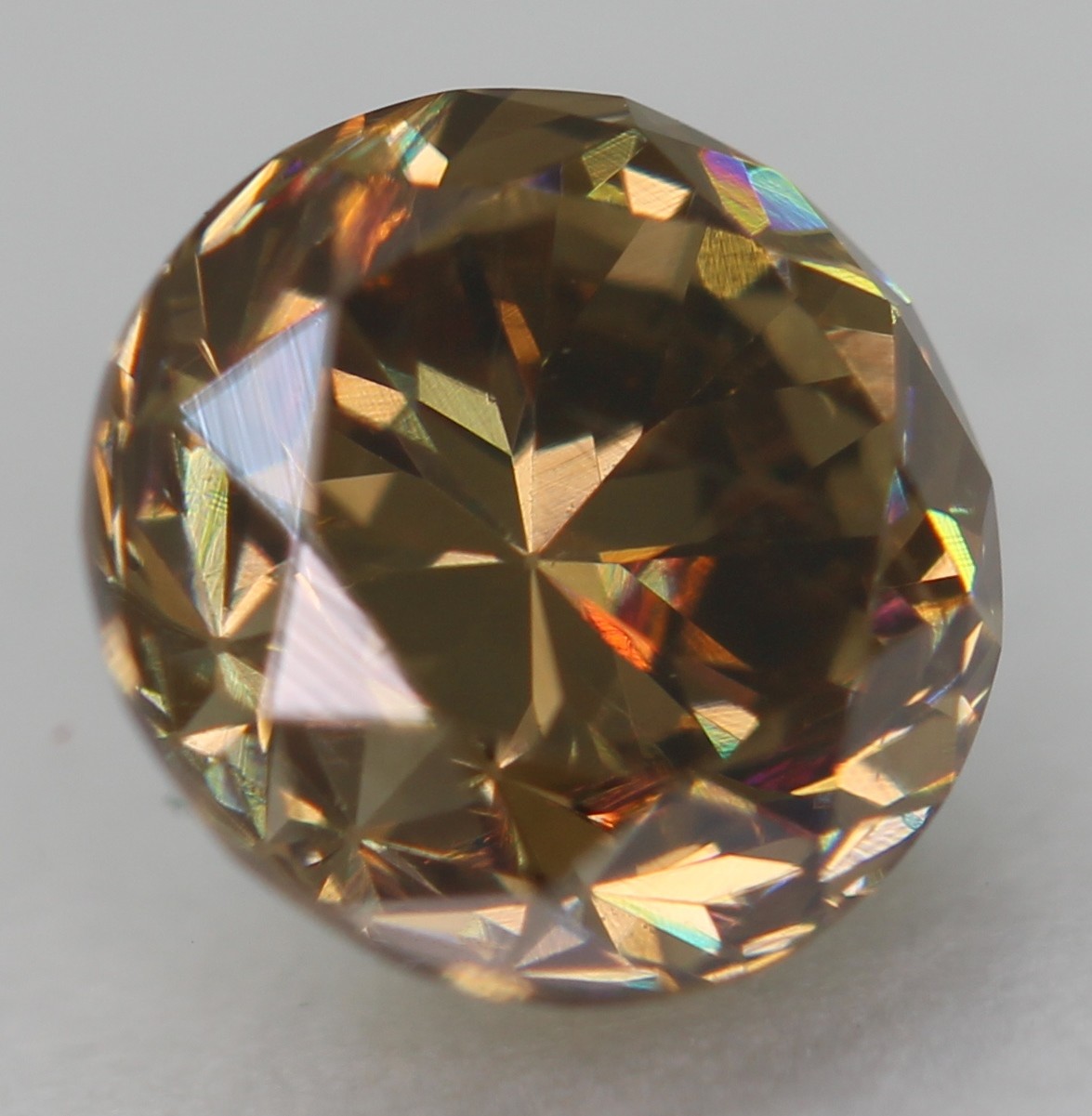 0.63 Ct Yellow Brown VVS2 Round Brilliant Natural Enhanced Diamond 5.18mm VIDEO