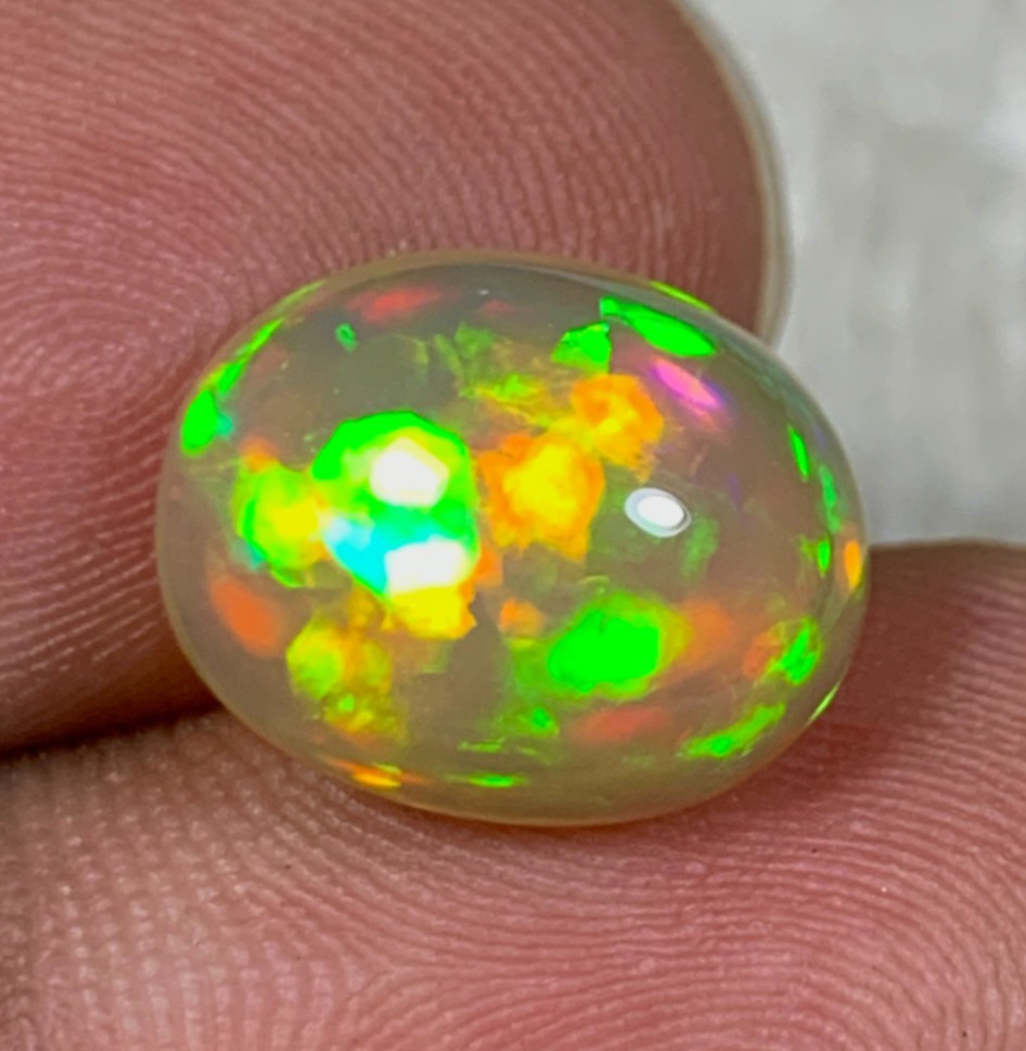 Natural Orange Ethiopian Welo Opal Rare Harlequin Pattern 4 Carats Oval Cabochon