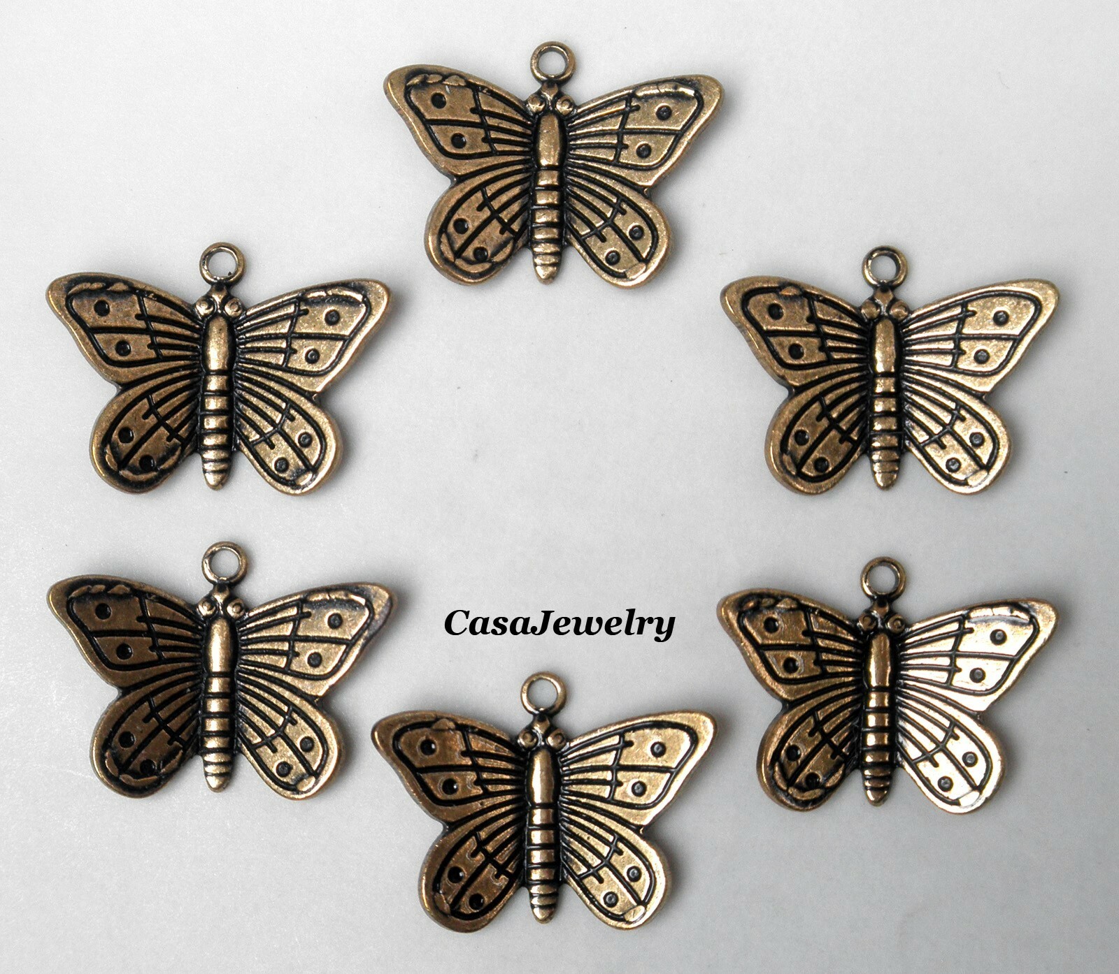 #0194 ANTIQUED GOLD SMALL DIE STRUCK BUTTERFLY W/TOP HANG RING – 6 Pc Lot