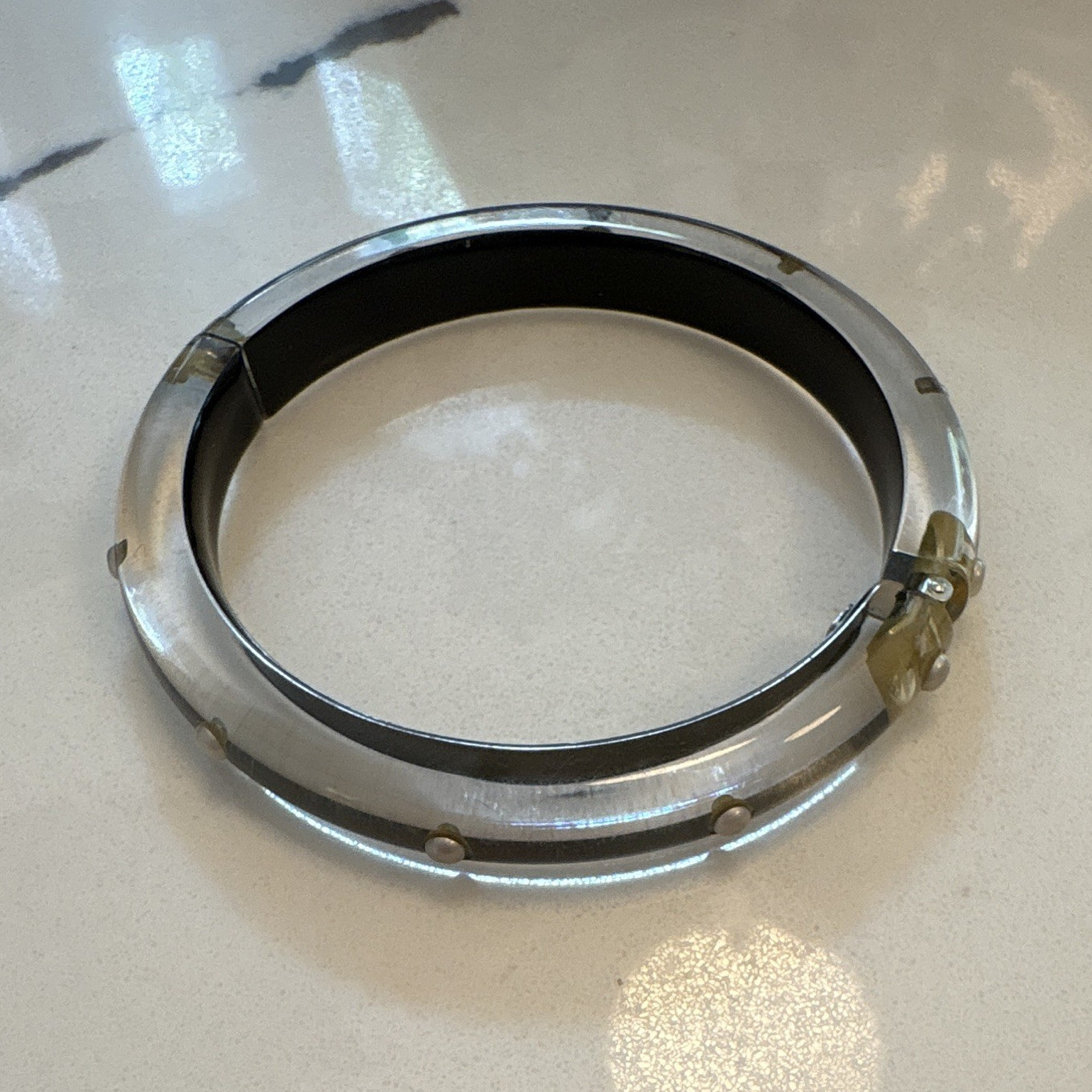Alexis Bittar bangle features polished, hand-carved lucite accented with crystal