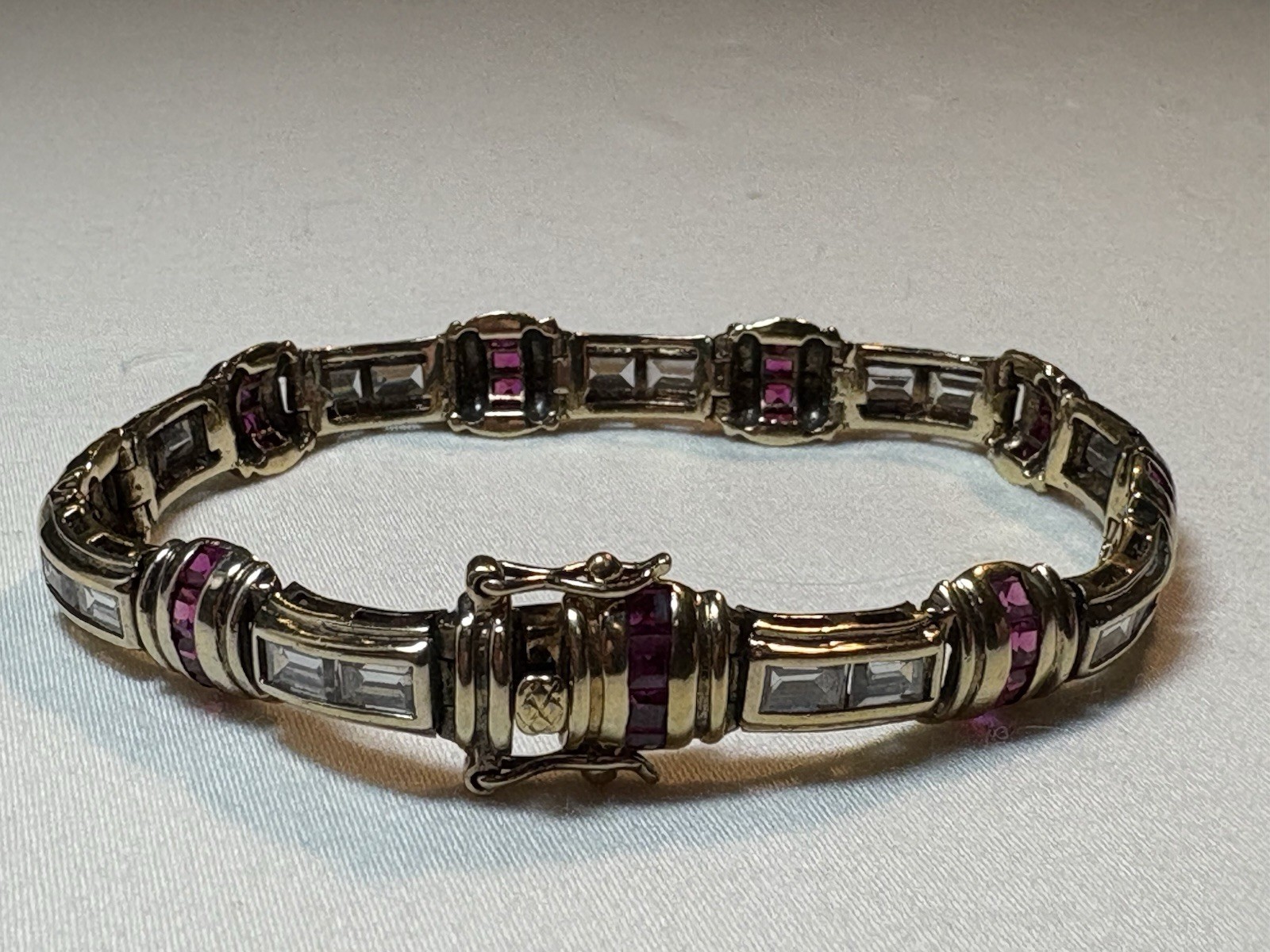 A sterling silver bracelet featuring baguette and round cubic zirconia stones.